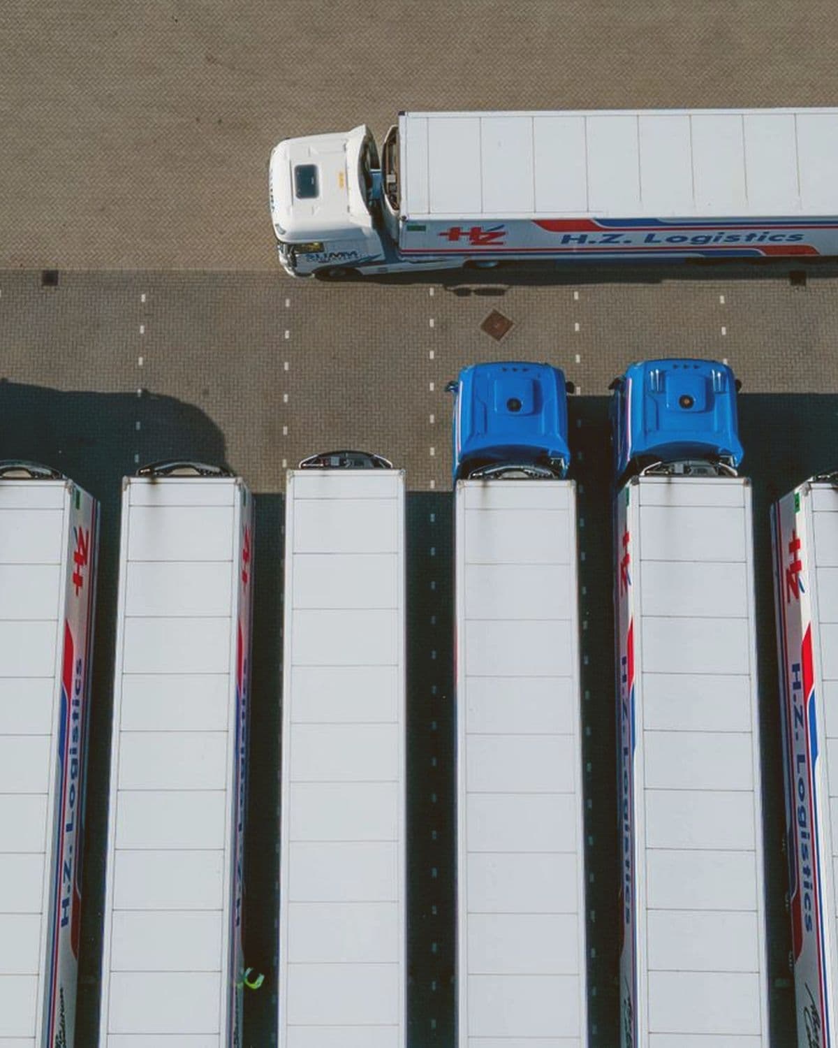 Fleet of freight trailers seen from above